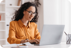 Business woman looking at a laptop.